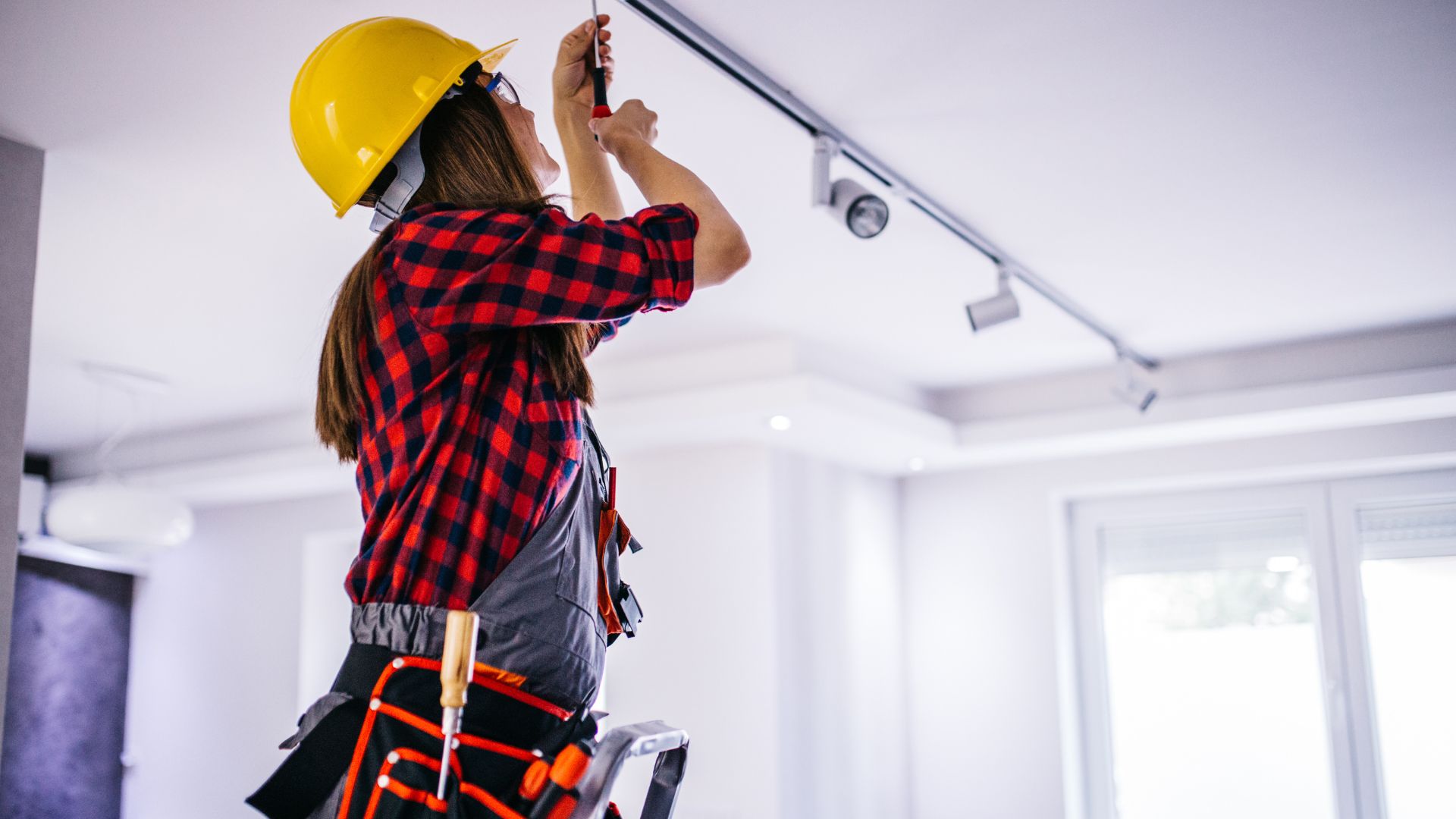 Electrician Installing Ceiling Track Lighting