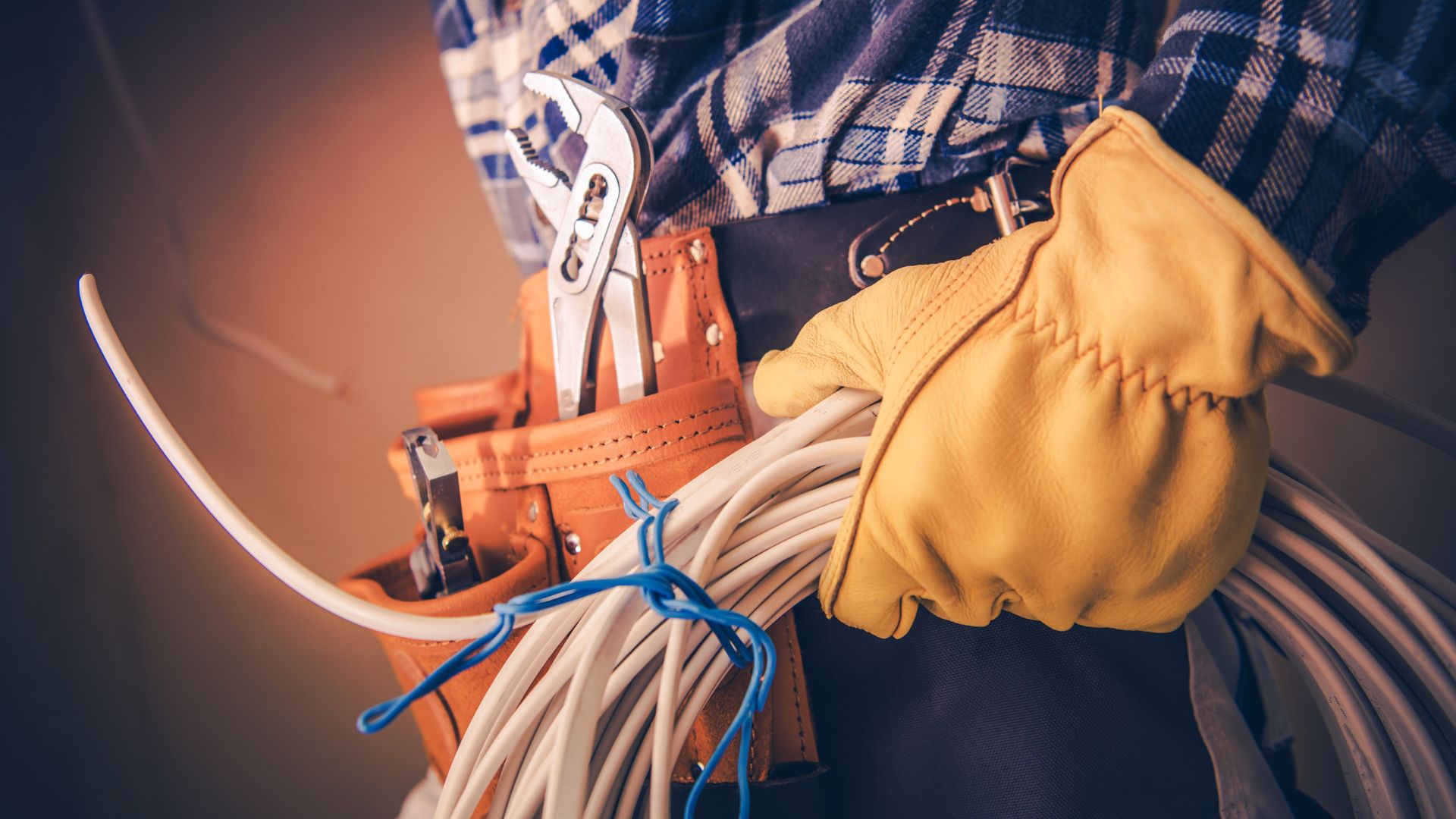 Electrician With Tools And Wiring Equipment