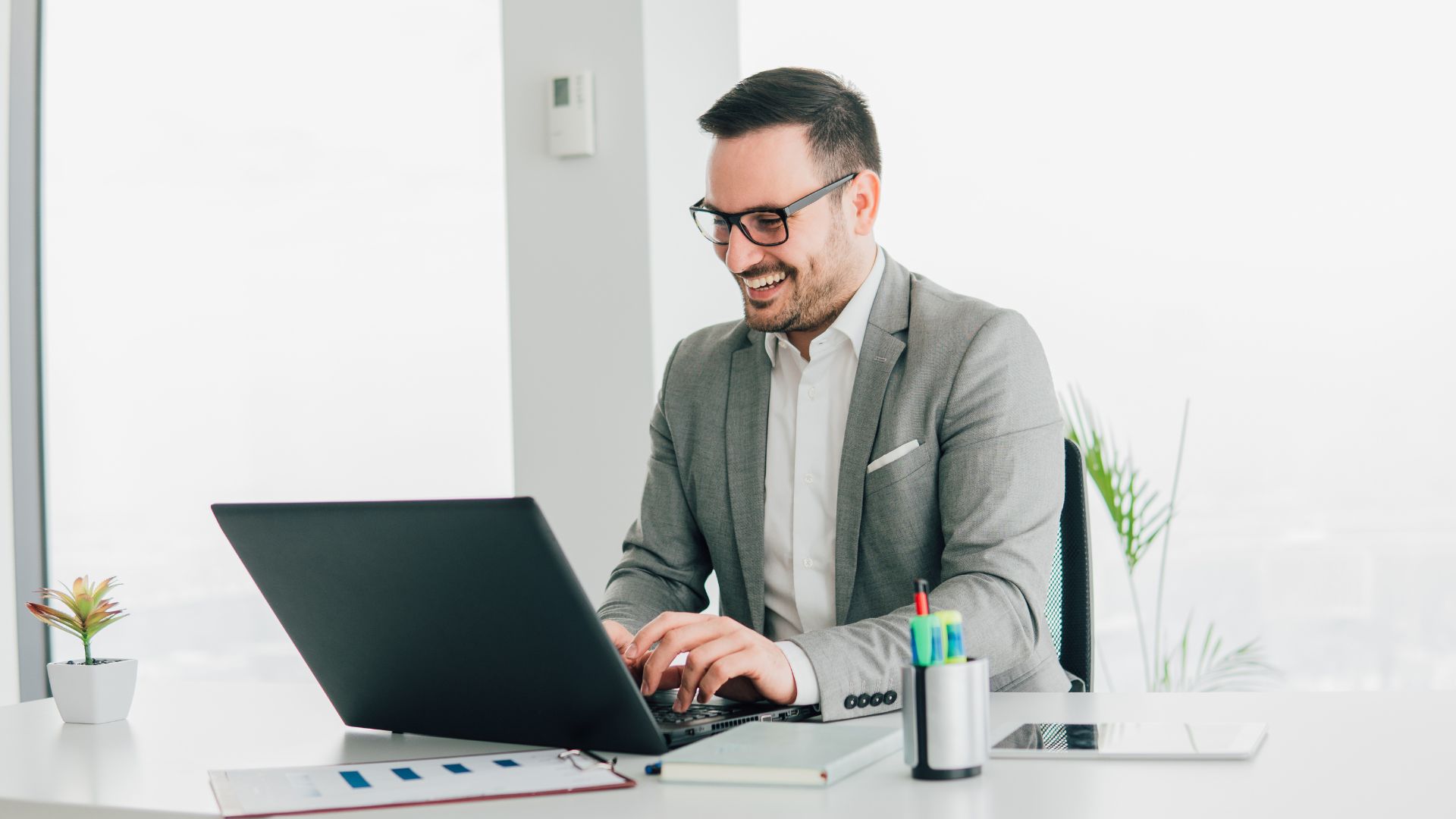 Professional Working On A Laptop In Office