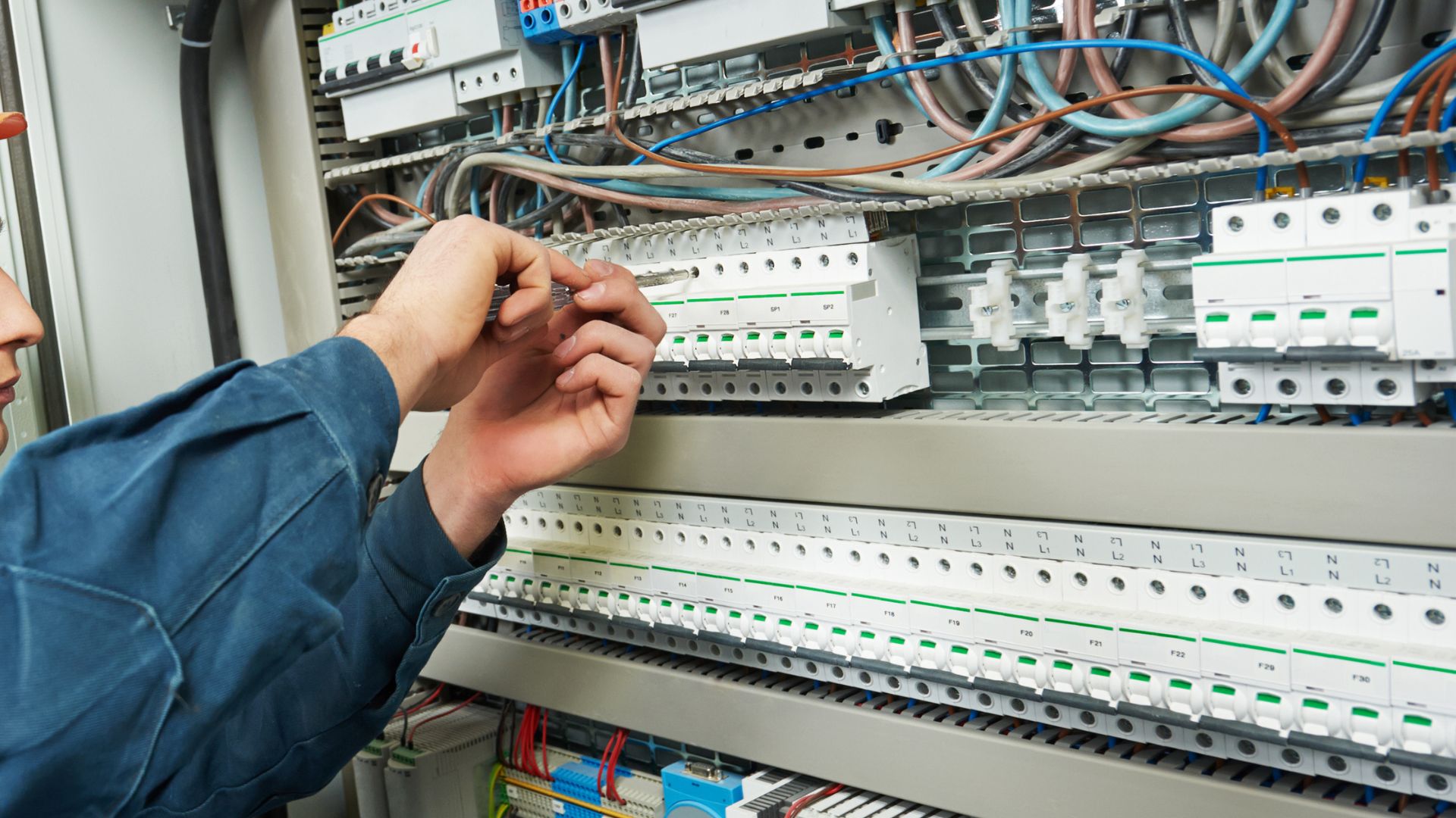 Technician Fixing An Electrical Panel